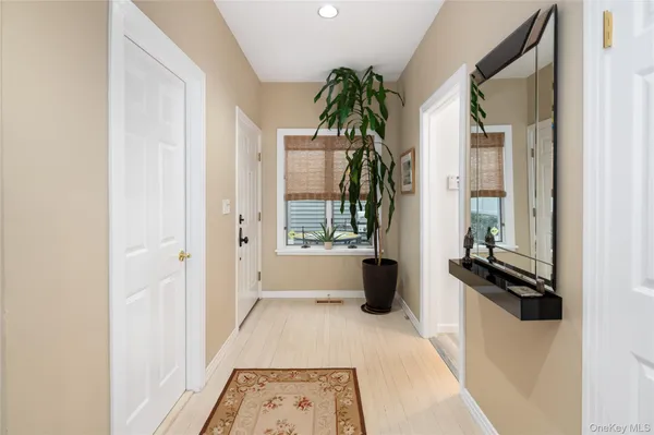 a view of a bathroom with a tub and windows