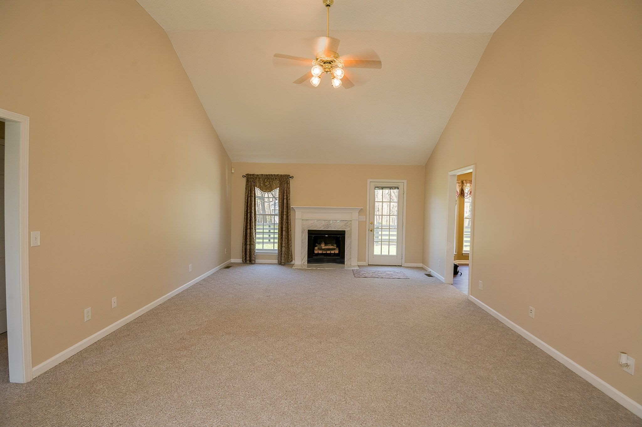 4165 Mt Zion Road Springfield, TN 37172 - Photo 20 of 42 a view of a room with a ceiling fan and a fireplace