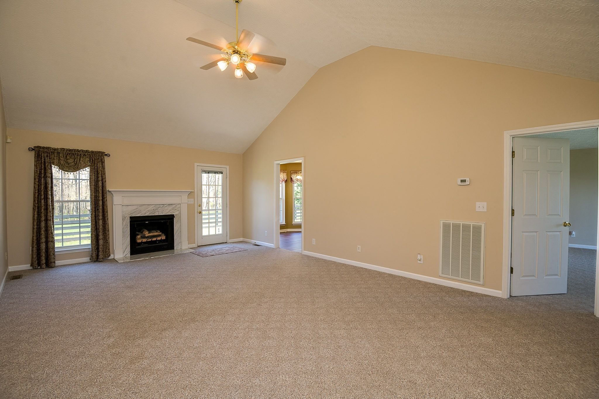 4165 Mt Zion Road Springfield, TN 37172 - Photo 23 of 42 a view of a room with a ceiling fan and a fireplace
