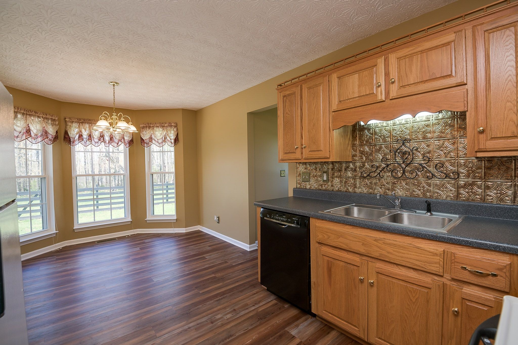 4165 Mt Zion Road Springfield, TN 37172 - Photo 24 of 42 a kitchen with granite countertop a sink window and cabinets