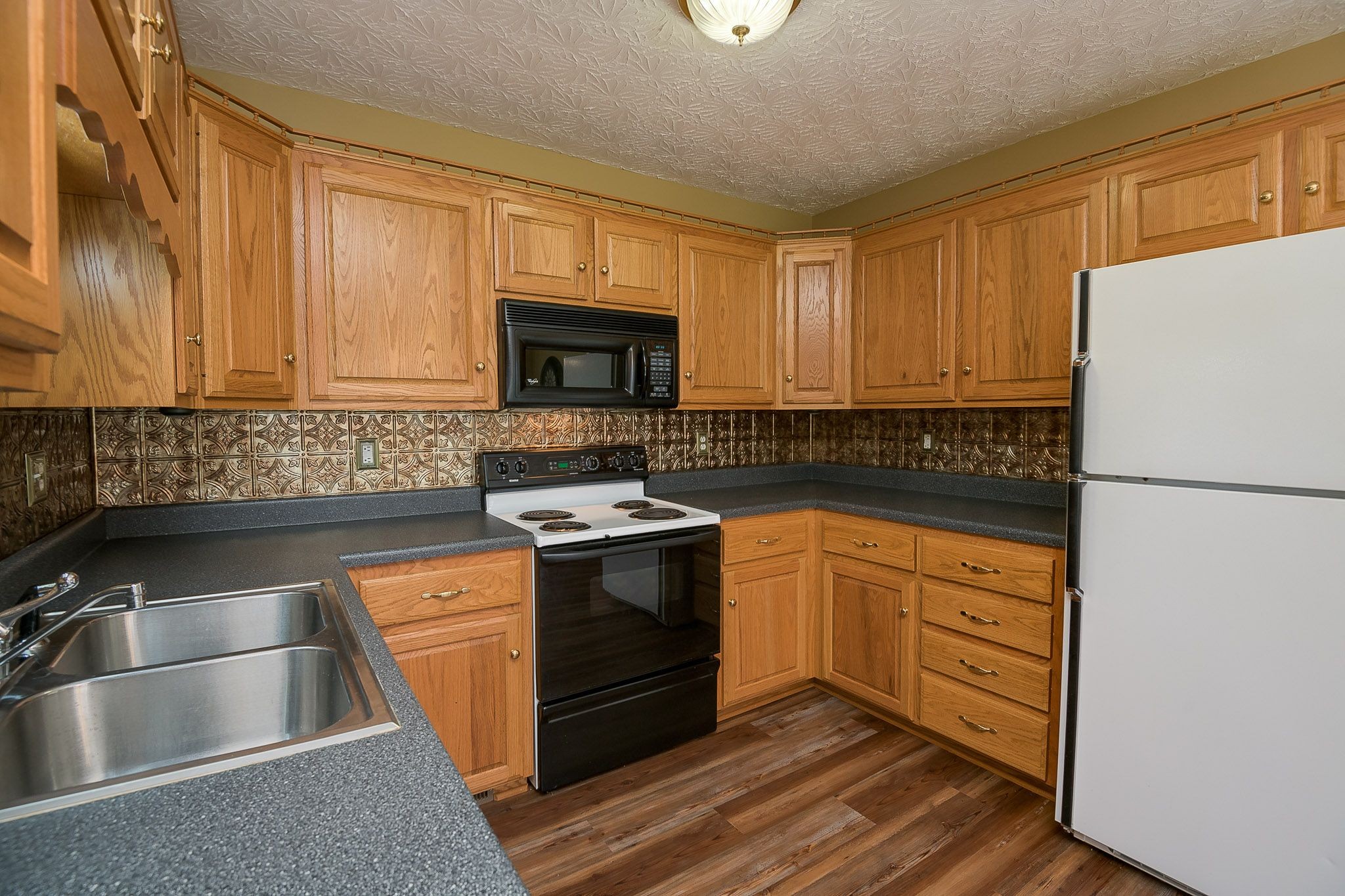 4165 Mt Zion Road Springfield, TN 37172 - Photo 25 of 42 a kitchen with stainless steel appliances granite countertop a stove a sink and a refrigerator