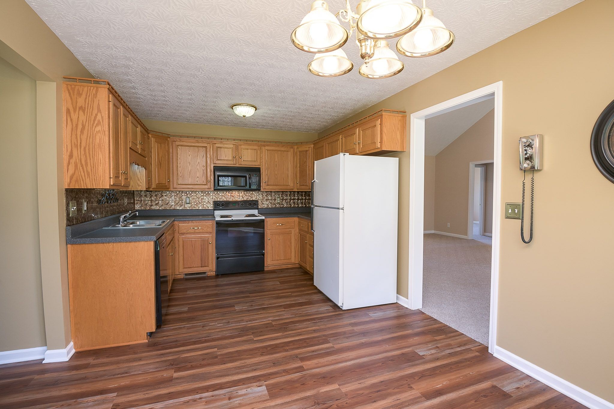 4165 Mt Zion Road Springfield, TN 37172 - Photo 28 of 42 a kitchen with a refrigerator a stove top oven a sink and cabinets