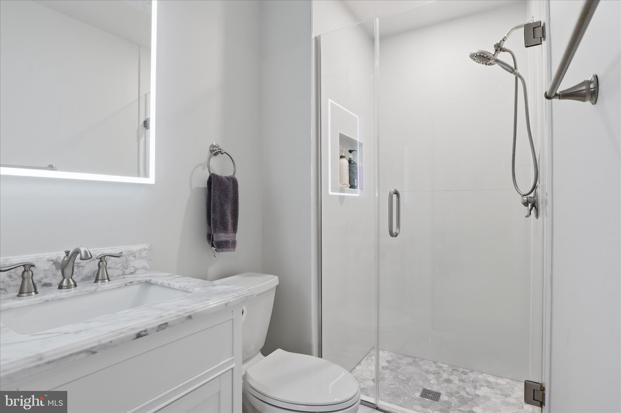71 Kinsman View Circle Silver Spring, MD 20901 - Photo 19 of 42 a bathroom with a granite countertop sink toilet and shower