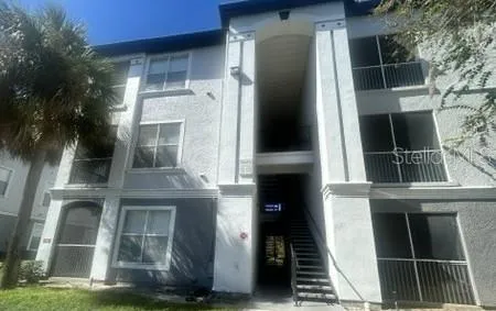 a view of front door and small yard