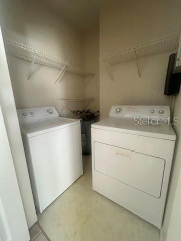 5807 Legacy Crescent Place, Unit 202 Riverview, FL 33578 - Photo 13 of 13 a utility room with dryer and washer