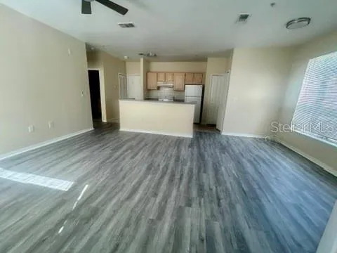 a view of a livingroom with wooden floor