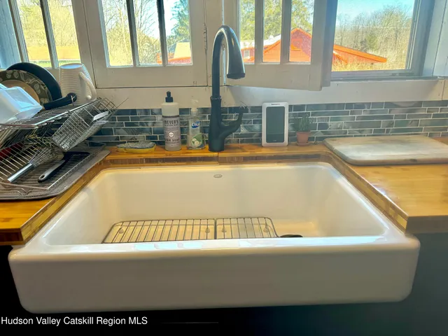 a bathroom with a bathtub and window