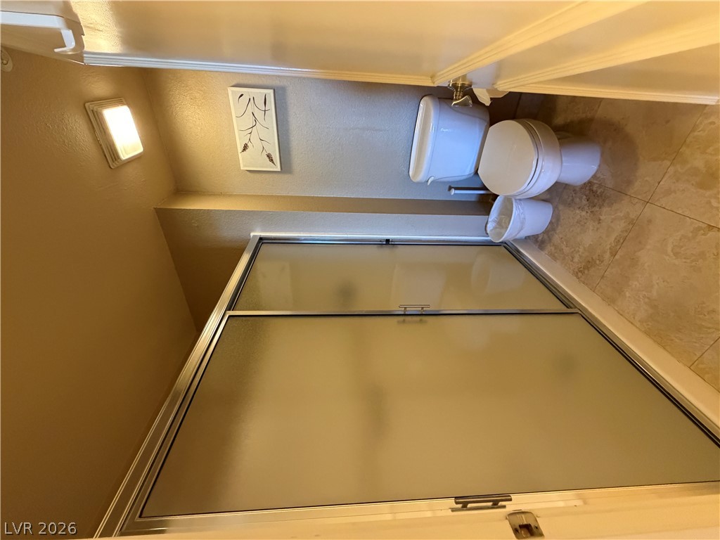 210 East Flamingo Road, Unit 426 Las Vegas, NV 89169 - Photo 12 of 17 A well-appointed bathroom features a practical shower enclosure and tiled flooring.