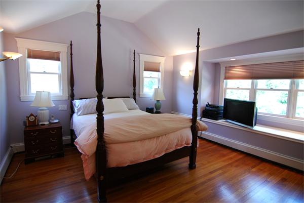 7 Mill Brook Road Lexington, MA 02420 - Photo 14 of 21 a bedroom with a bed and wooden floor