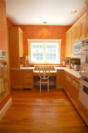 7 Mill Brook Road Lexington, MA 02420 - Photo 8 of 21 a kitchen with a sink dining table and chairs