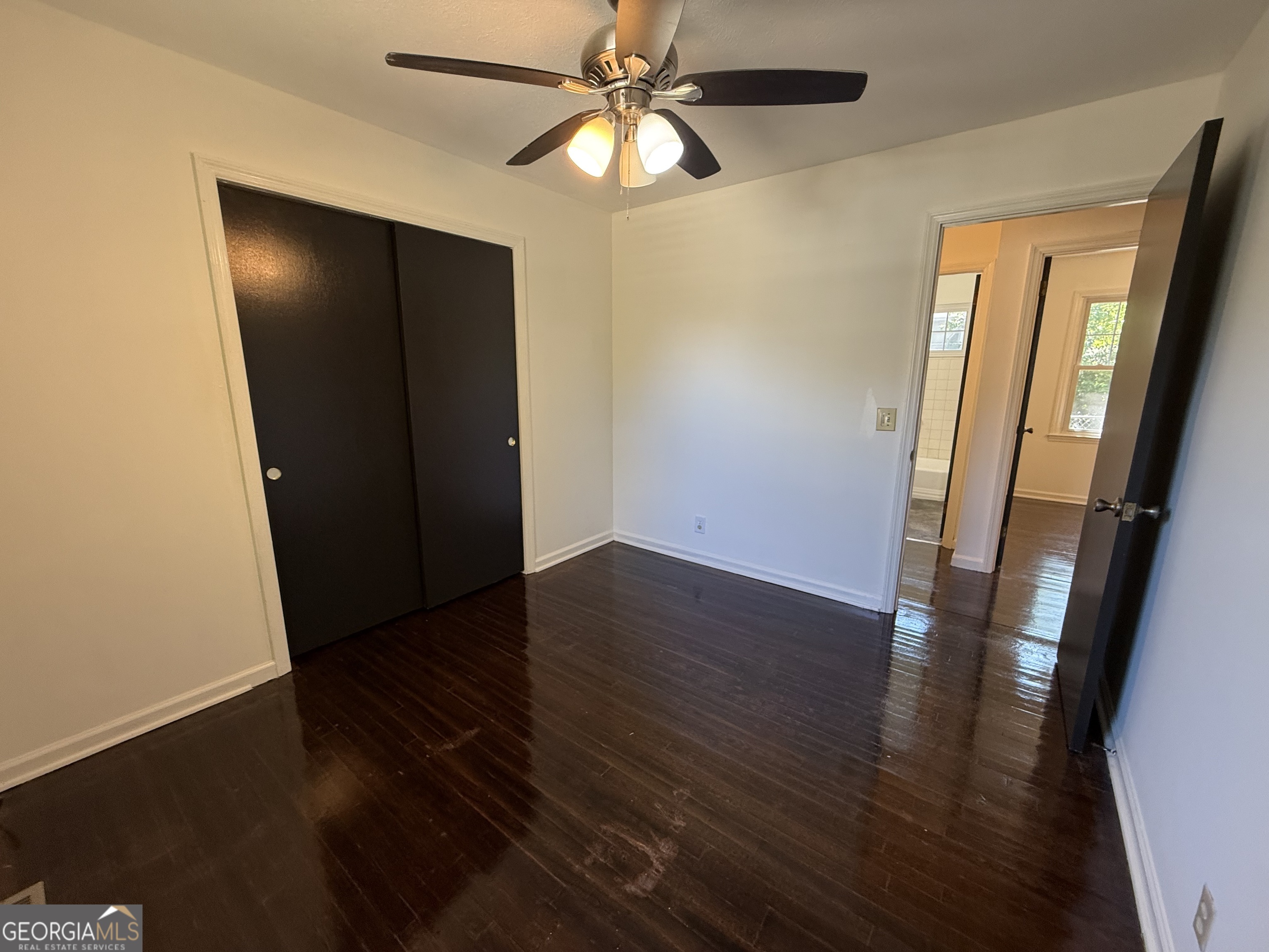 179 Youngs Mill Road LaGrange, GA 30241 - Photo 23 of 30 an empty room with wooden floor and entryway