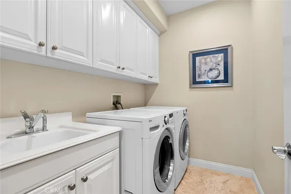 a kitchen with refrigerator and cabinets