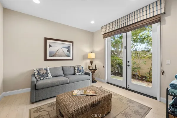 a view of a livingroom with furniture window and wooden floor
