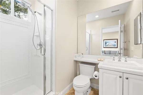 a living room with furniture wooden floor and a large window