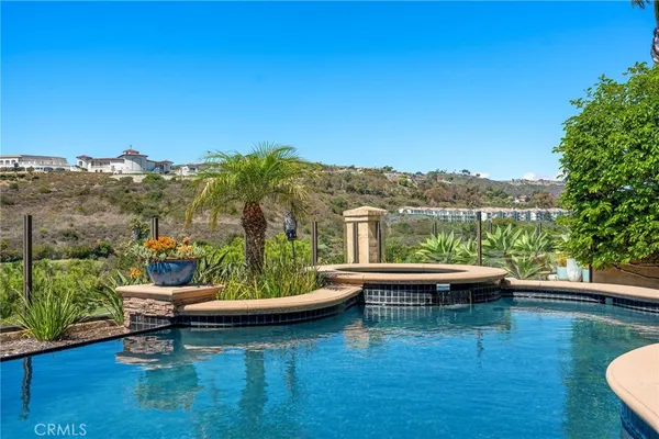 a view of swimming pool and outdoor seating