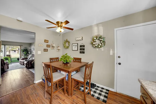 a view of a dining room with furniture and wooden floor