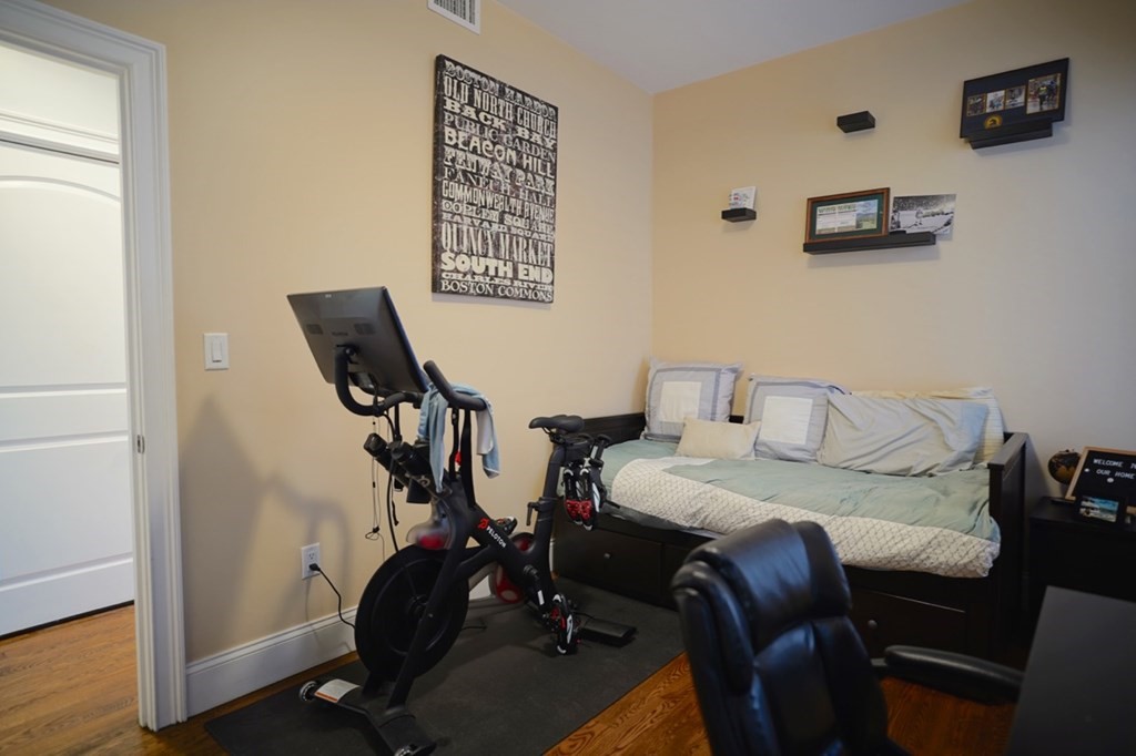 249 Lexington Street, Unit 2 Boston, MA 02128 - Photo 13 of 28 a view of a workspace with furniture and wooden floor