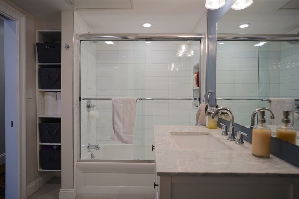 249 Lexington Street, Unit 2 Boston, MA 02128 - Photo 15 of 28 a bathroom with a sink and a mirror