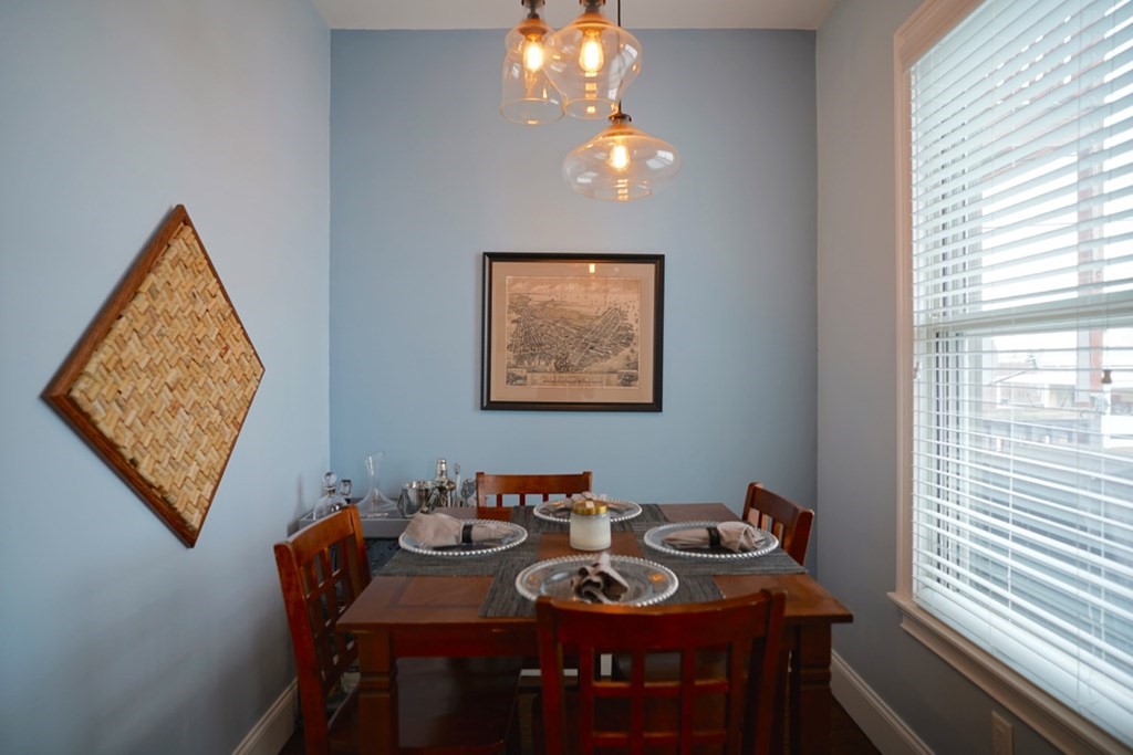 249 Lexington Street, Unit 2 Boston, MA 02128 - Photo 16 of 28 a view of a dining room with furniture and a window