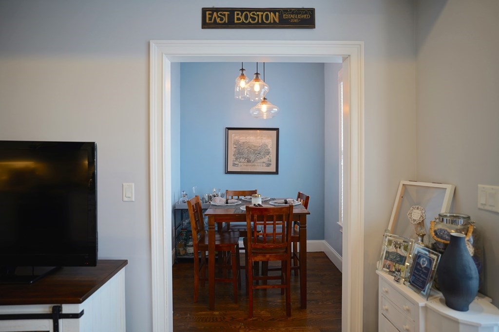 249 Lexington Street, Unit 2 Boston, MA 02128 - Photo 17 of 28 a view of a dining room with furniture and wooden floor