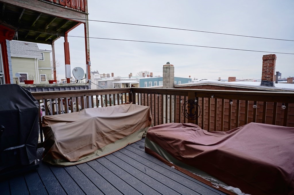 249 Lexington Street, Unit 2 Boston, MA 02128 - Photo 18 of 28 a view of a roof deck with wooden floor and outdoor seating