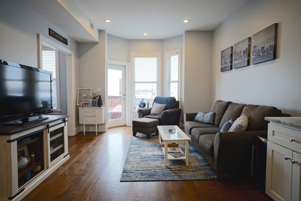 249 Lexington Street, Unit 2 Boston, MA 02128 - Photo 3 of 28 a living room with furniture and a flat screen tv