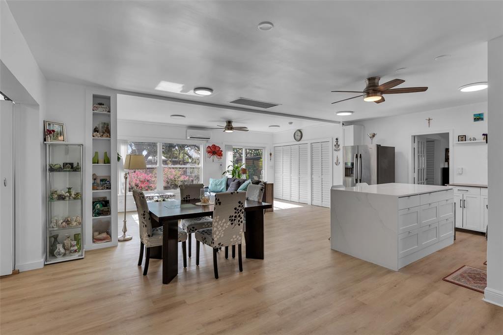3194 Taft Street Hollywood, FL 33021 - Photo 17 of 48 a view of a dining room with furniture and wooden floor
