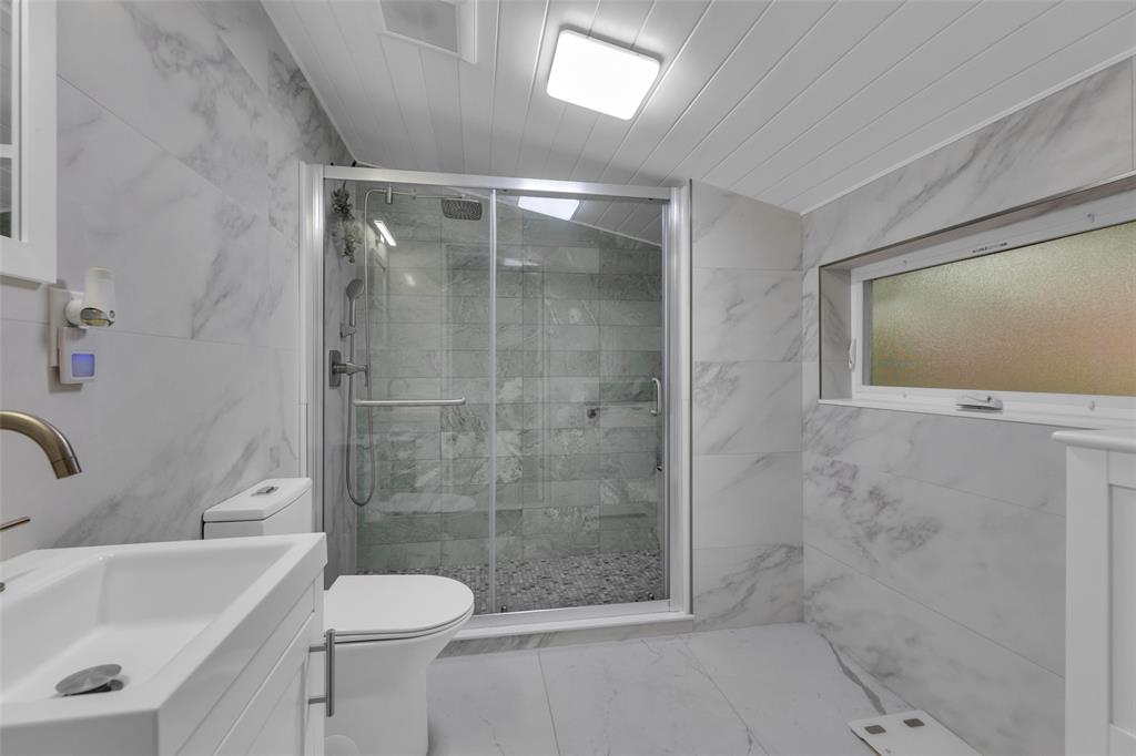 3194 Taft Street Hollywood, FL 33021 - Photo 20 of 48 a bathroom with a shower and a sink