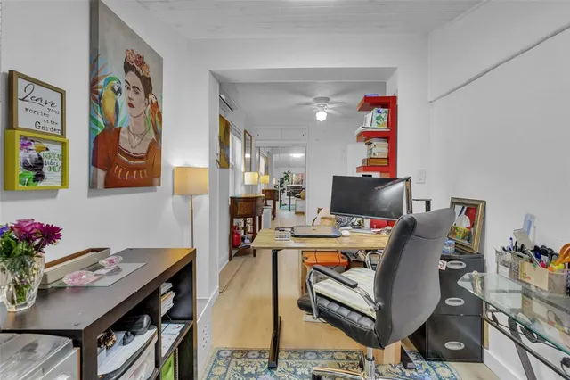 a view of a workspace with furniture