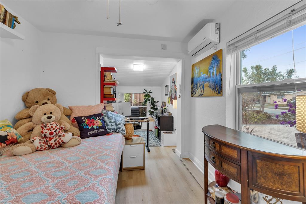 3194 Taft Street Hollywood, FL 33021 - Photo 28 of 48 a bed room with furniture and a flat screen tv