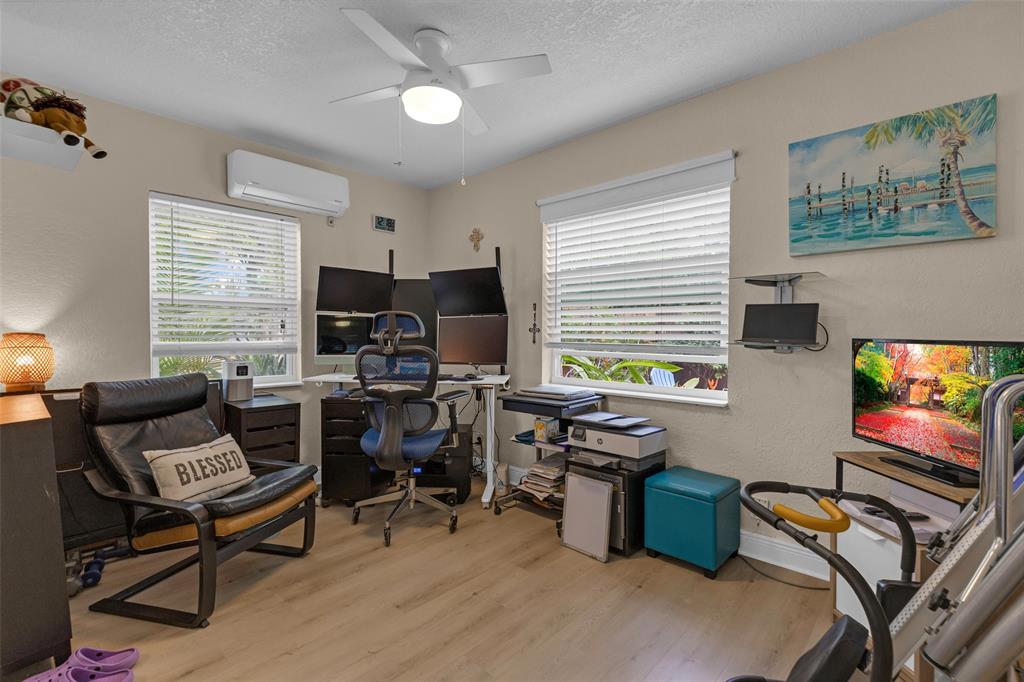 3194 Taft Street Hollywood, FL 33021 - Photo 31 of 48 a view of a workspace with furniture and a window