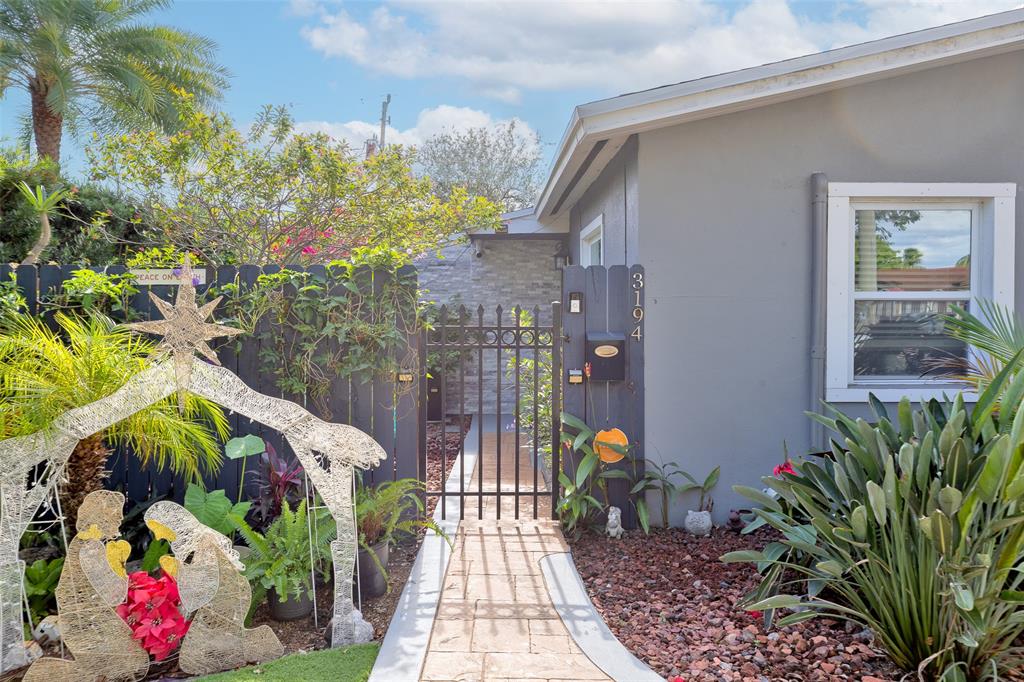 3194 Taft Street Hollywood, FL 33021 - Photo 34 of 48 a view of a house with a potted plant