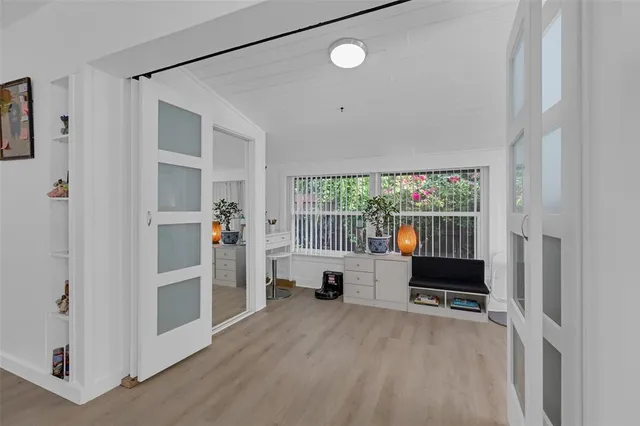 a living room with furniture and a window
