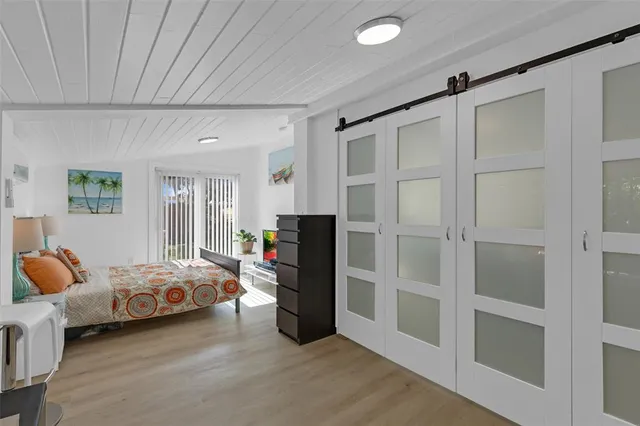 a bedroom with bed and window