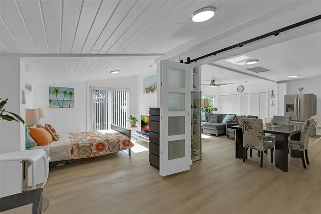 a bedroom with furniture and a window