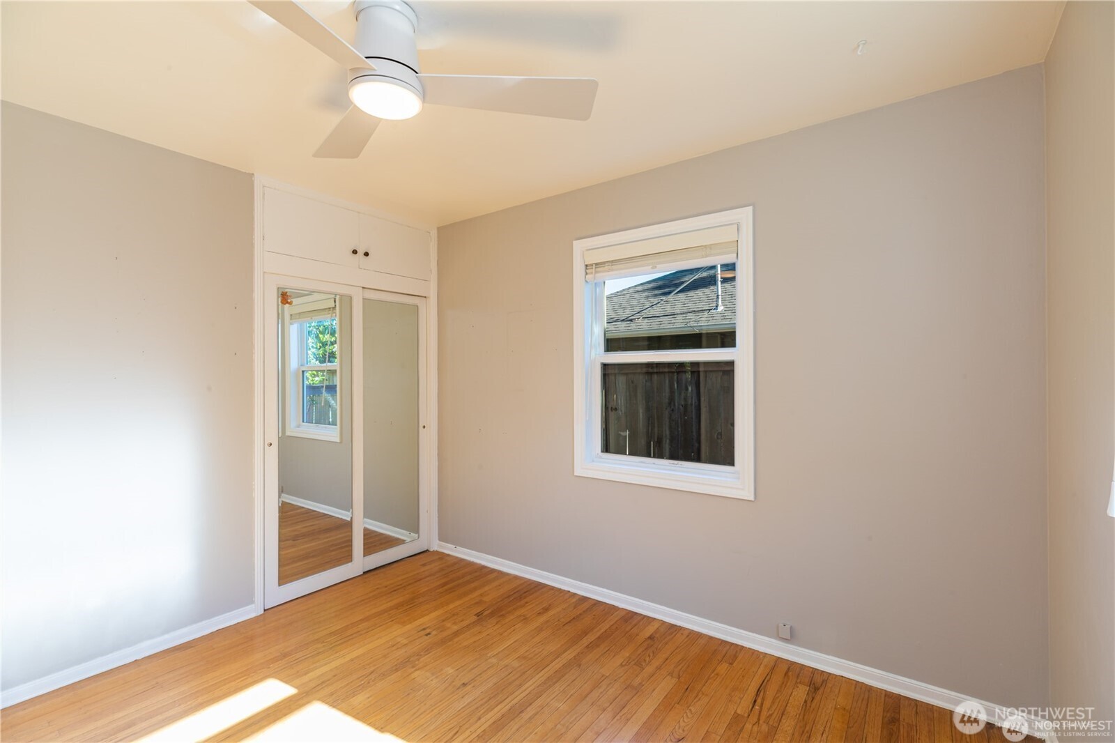 8601 36th Avenue Southwest Seattle, WA 98126 - Photo 18 of 28 an empty room with windows