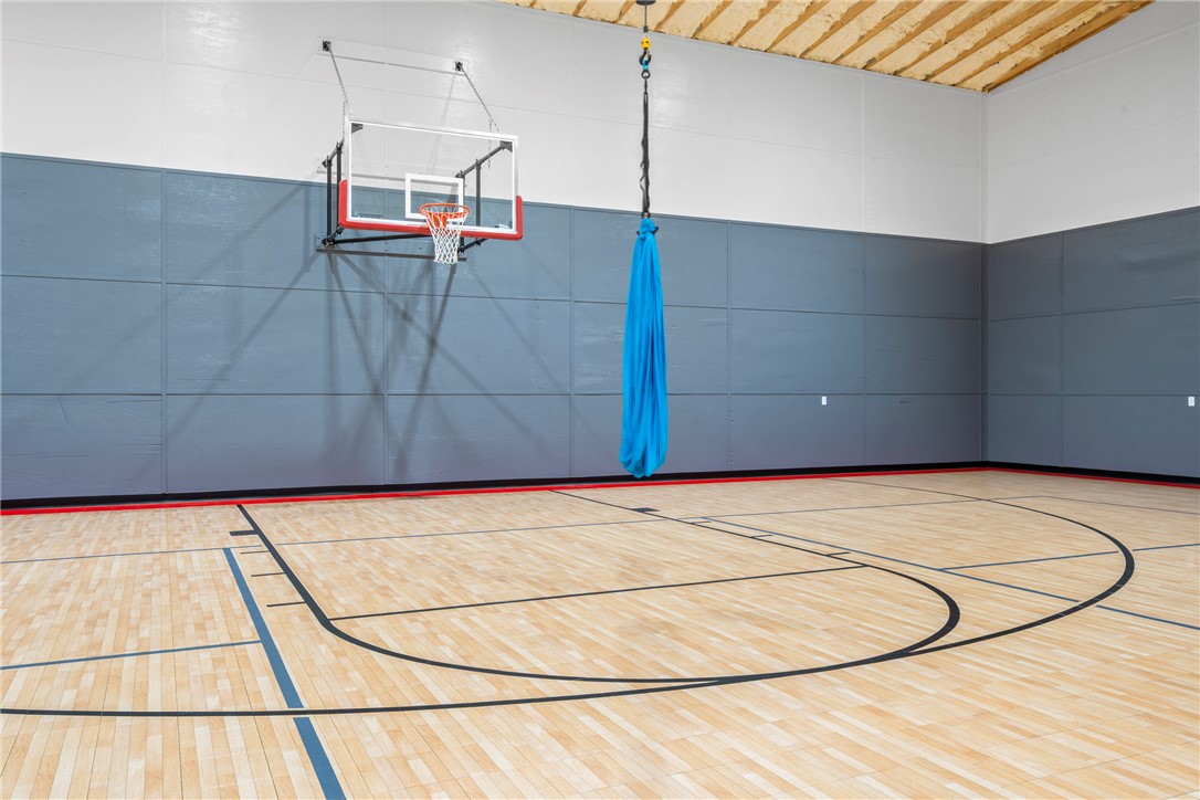 16556 East Hewitt Springs Road Springdale, AR 72764 - Photo 54 of 60 Indoor athletic court with floor markings, a wall-mounted basketball hoop,
