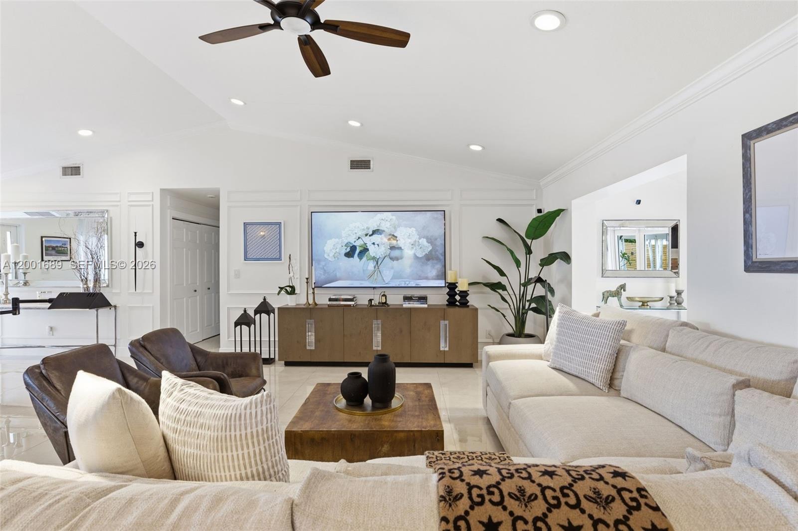 14491 Southwest 161 Street Miami, FL 33177 - Photo 14 of 55 a living room with furniture ceiling fan and a rug