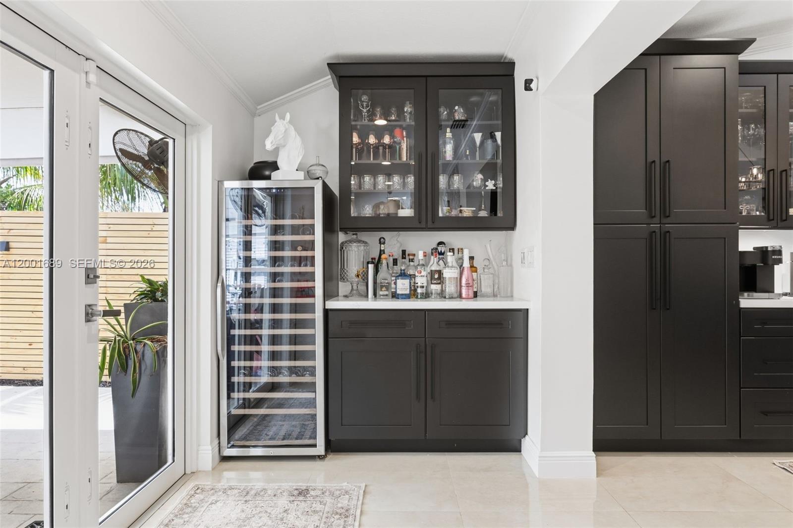14491 Southwest 161 Street Miami, FL 33177 - Photo 20 of 55 a kitchen with a refrigerator and a window