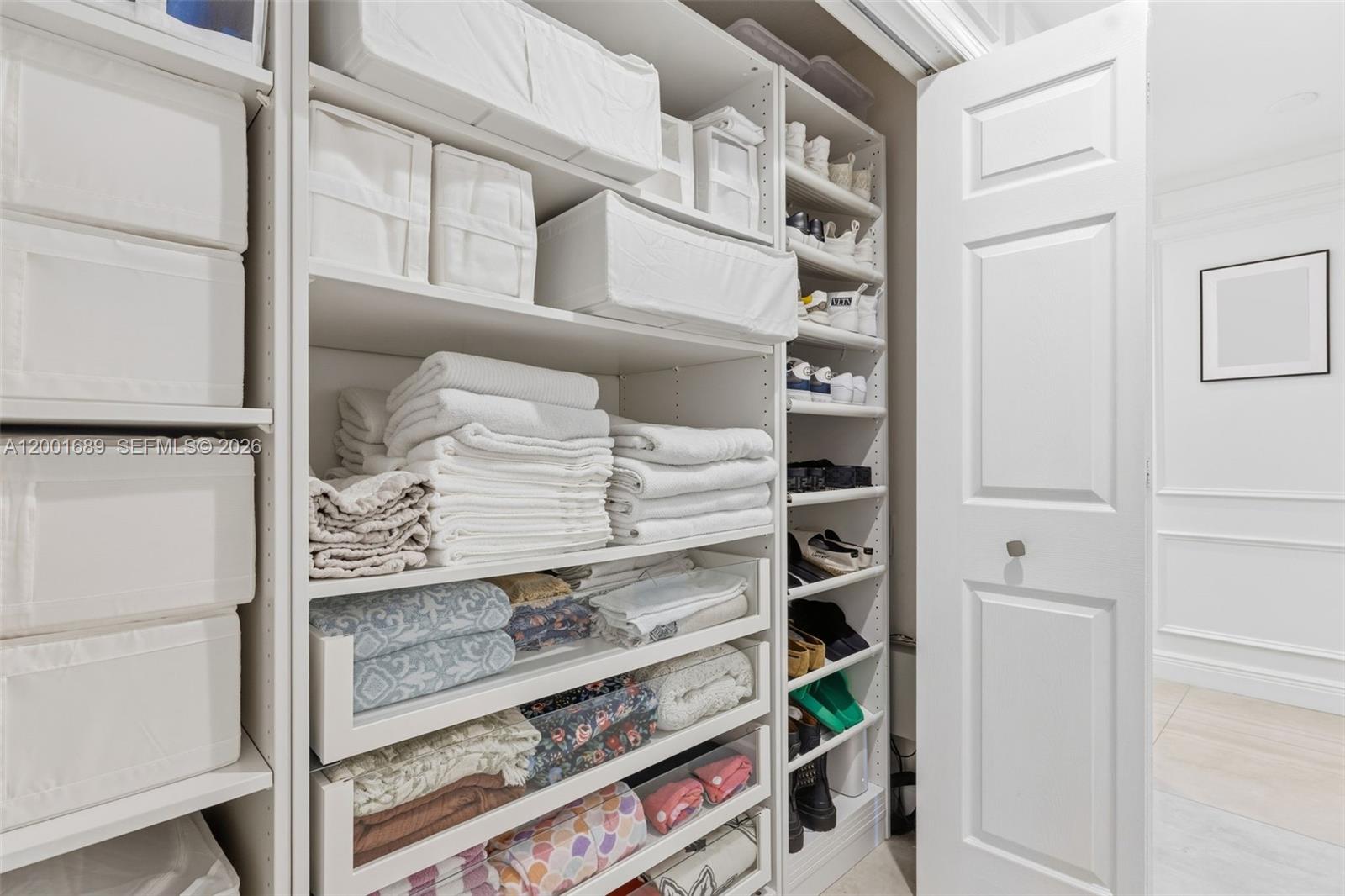 14491 Southwest 161 Street Miami, FL 33177 - Photo 27 of 55 a view of walk in closet with clothes and shoes