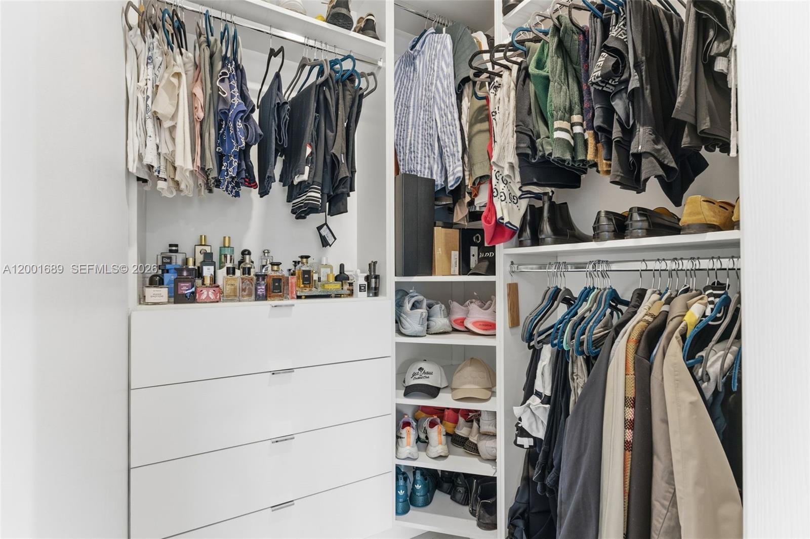 14491 Southwest 161 Street Miami, FL 33177 - Photo 33 of 55 a view of walk in closet with clothes and shoes