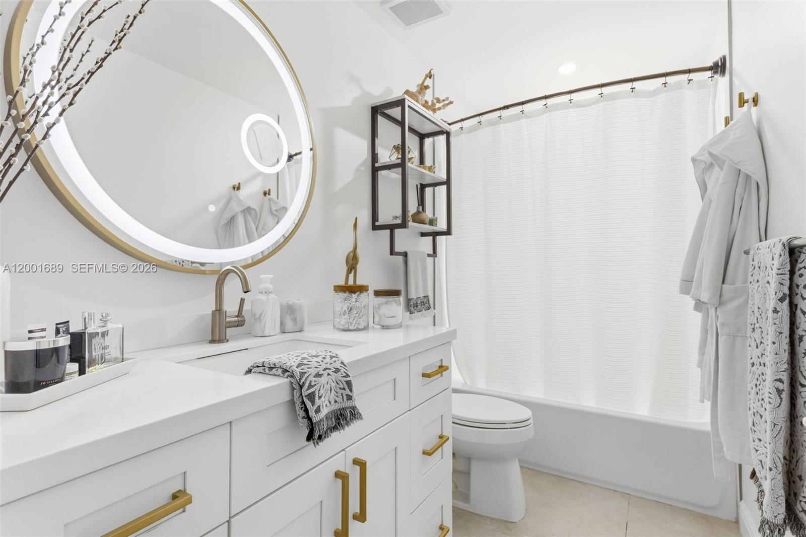 14491 Southwest 161 Street Miami, FL 33177 - Photo 39 of 55 a bathroom with a double vanity sink toilet and shower