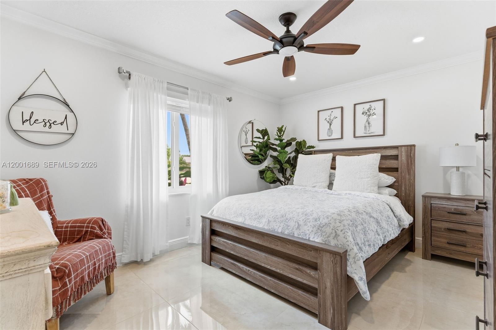 14491 Southwest 161 Street Miami, FL 33177 - Photo 40 of 55 a bed room with a bed and a chandelier