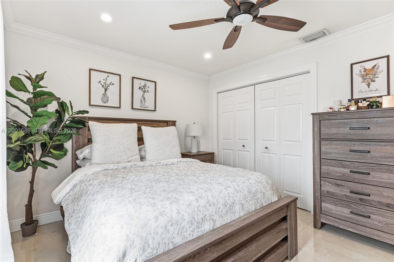 14491 Southwest 161 Street Miami, FL 33177 - Photo 42 of 55 a bedroom with a bed and a dresser