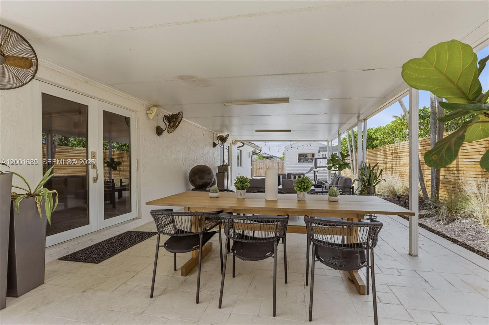14491 Southwest 161 Street Miami, FL 33177 - Photo 43 of 55 a dining room with furniture and window