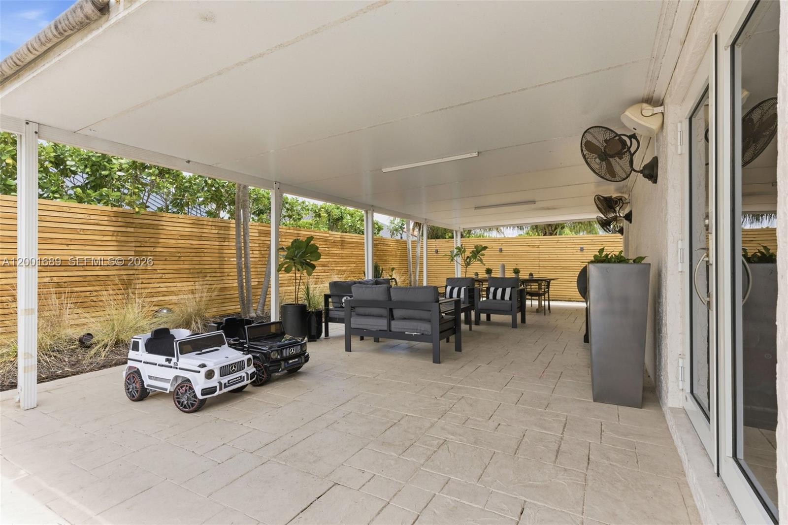 14491 Southwest 161 Street Miami, FL 33177 - Photo 47 of 55 a garage with furniture and large windows