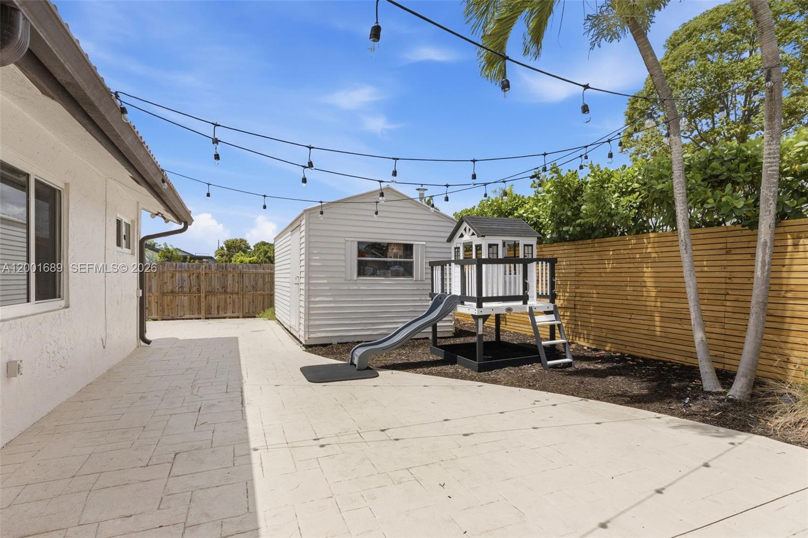 14491 Southwest 161 Street Miami, FL 33177 - Photo 48 of 55 a front view of a house with a yard