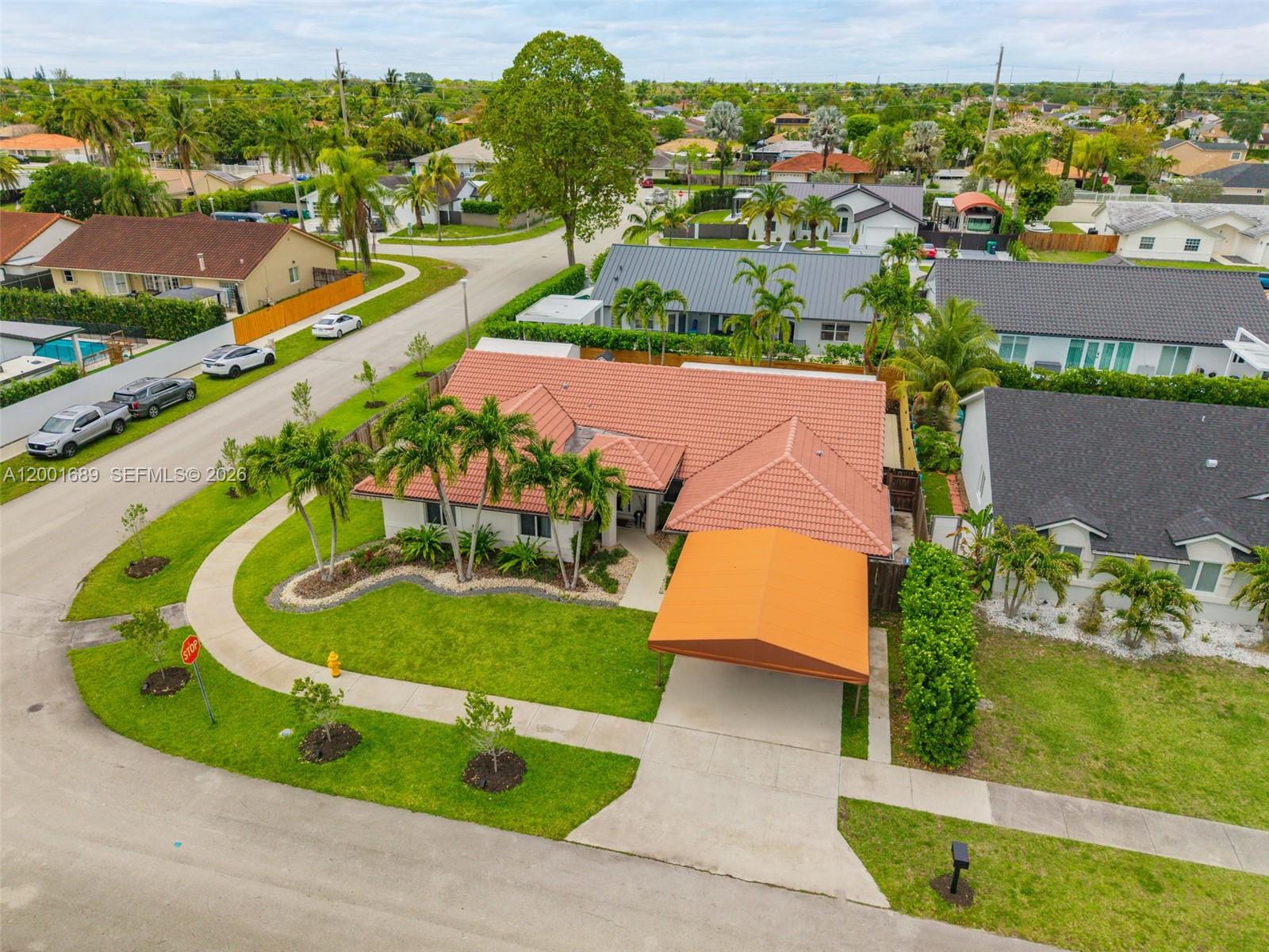 14491 Southwest 161 Street Miami, FL 33177 - Photo 50 of 55 an aerial view of a house with a yard and lake view