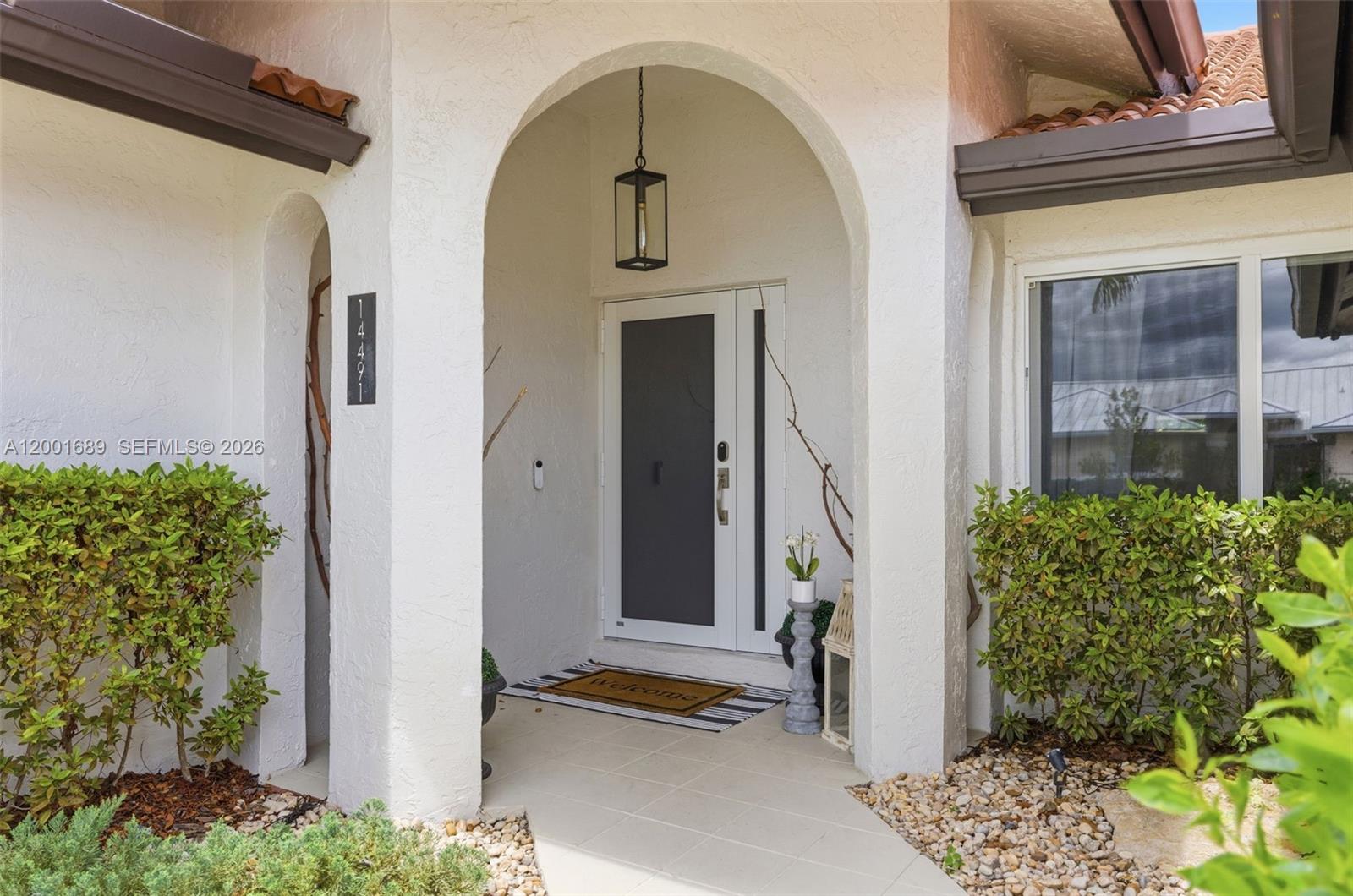 14491 Southwest 161 Street Miami, FL 33177 - Photo 5 of 55 a view of a entryway door of the house