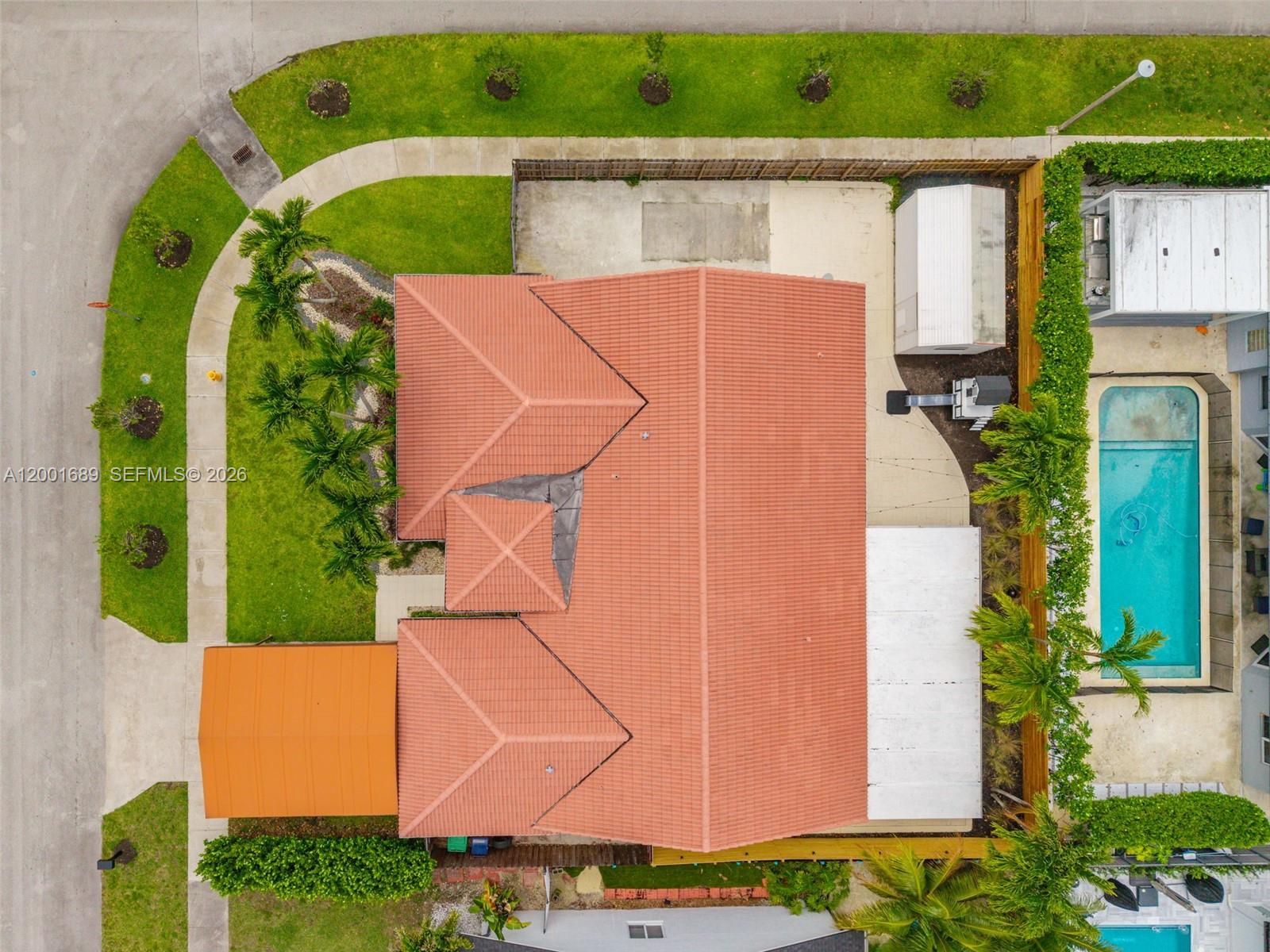 14491 Southwest 161 Street Miami, FL 33177 - Photo 52 of 55 an aerial view of a house with a yard and potted plants